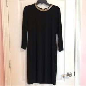 Calvin Klein black sleeve dress with double gold chain around the neck